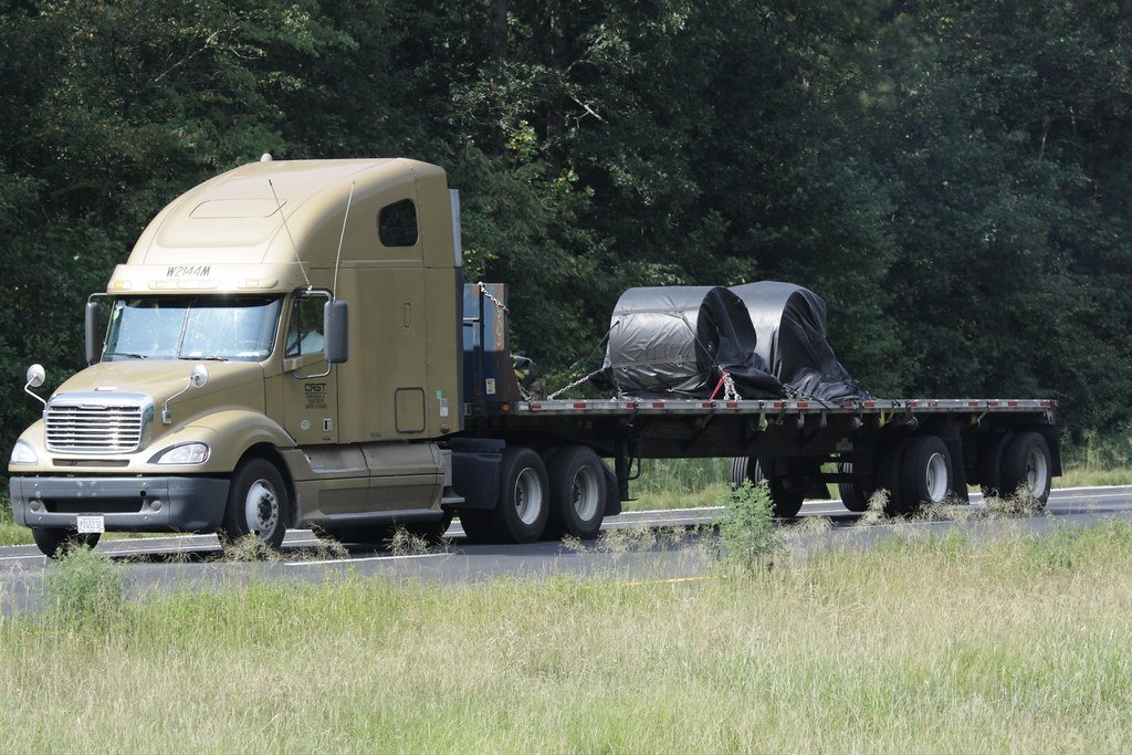 Hotshot trucking dispatch managing flatbed freight across regional lanes