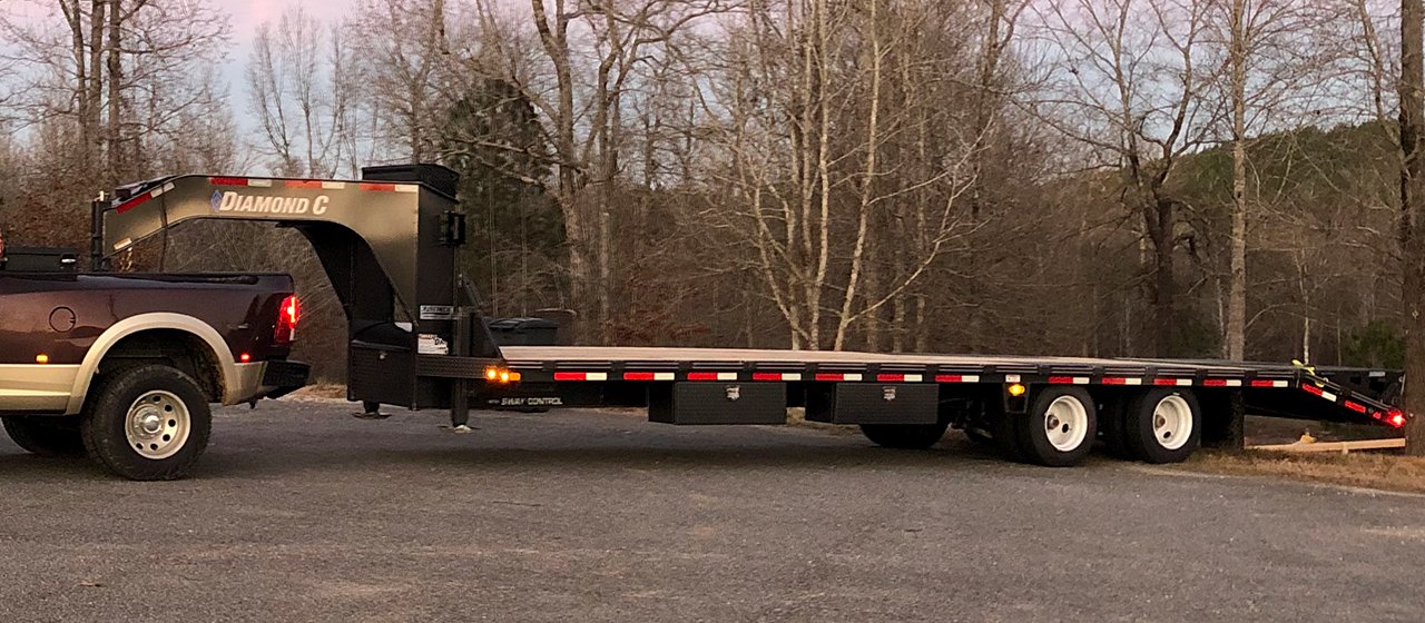 Hotshot trucking dispatch for time-sensitive freight using a pickup truck and gooseneck trailer