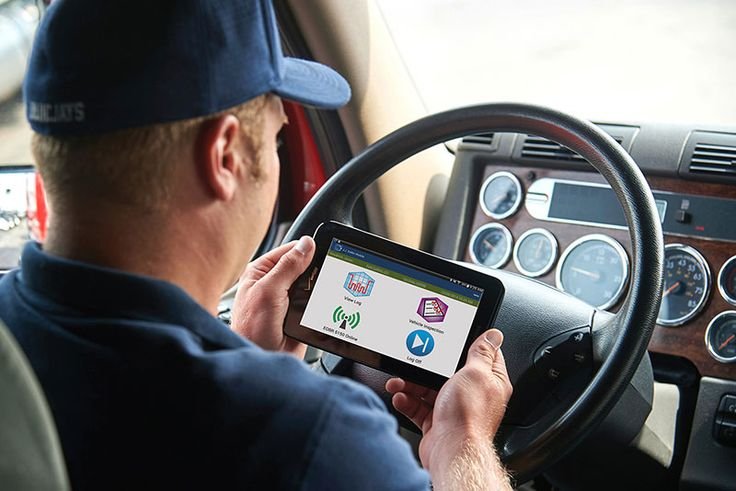 Owner operator reviewing ELD logs before starting a trip